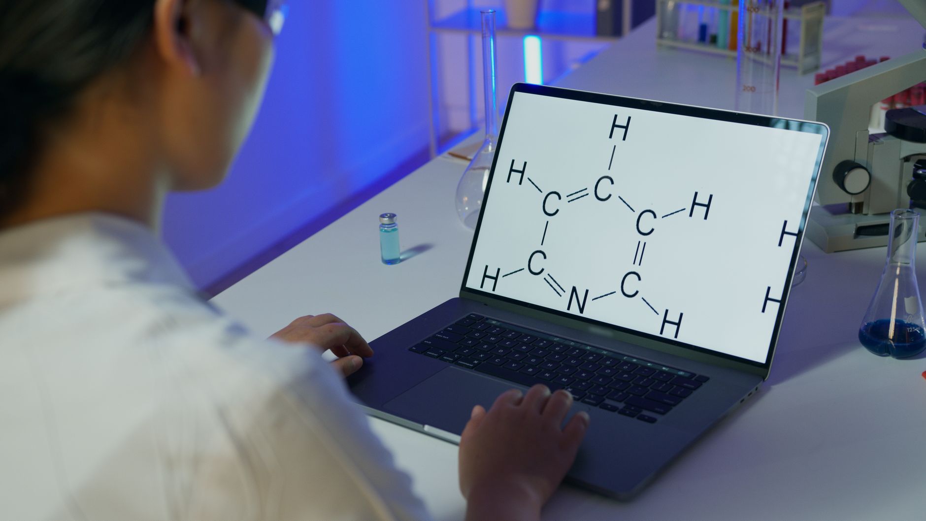 scientist examining glowing molecular structure RNA strand artificial intelligence laboratory microscope
