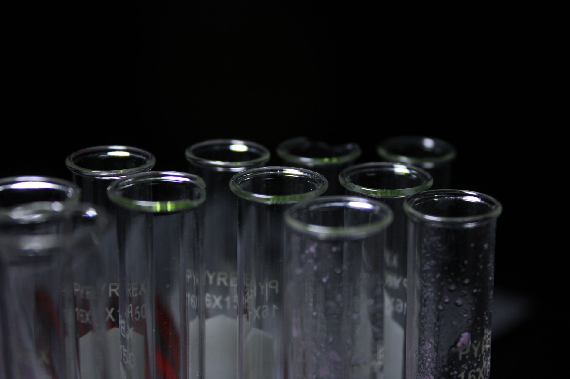 close-up photoluminescent construction material sample glowing in laboratory