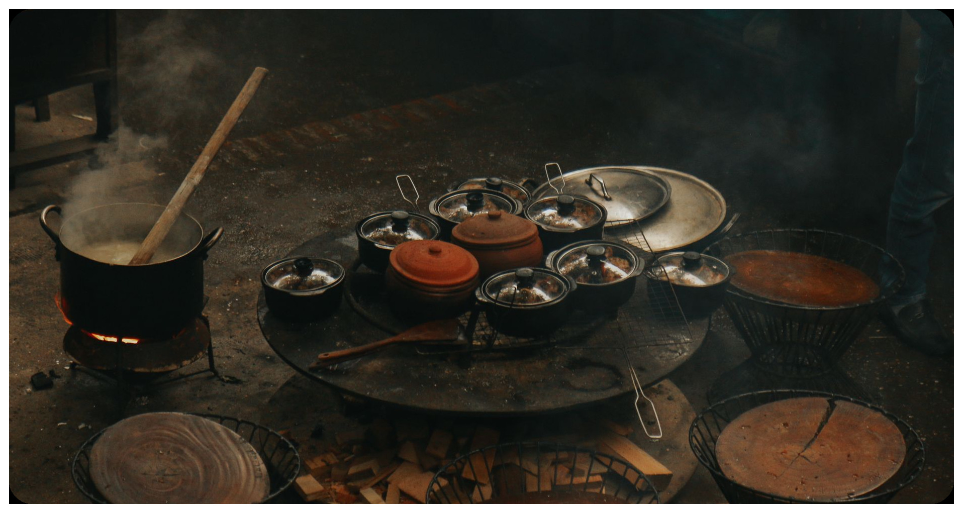 medieval kitchen monastery spain large clay pot simmering broth fire traditional cooking scene historical recreation