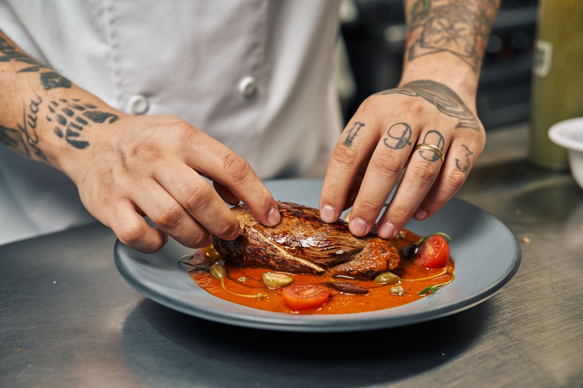 chef hands preparing gourmet plate with precision artistic elements colorful ingredients modern gastronomy creative expression