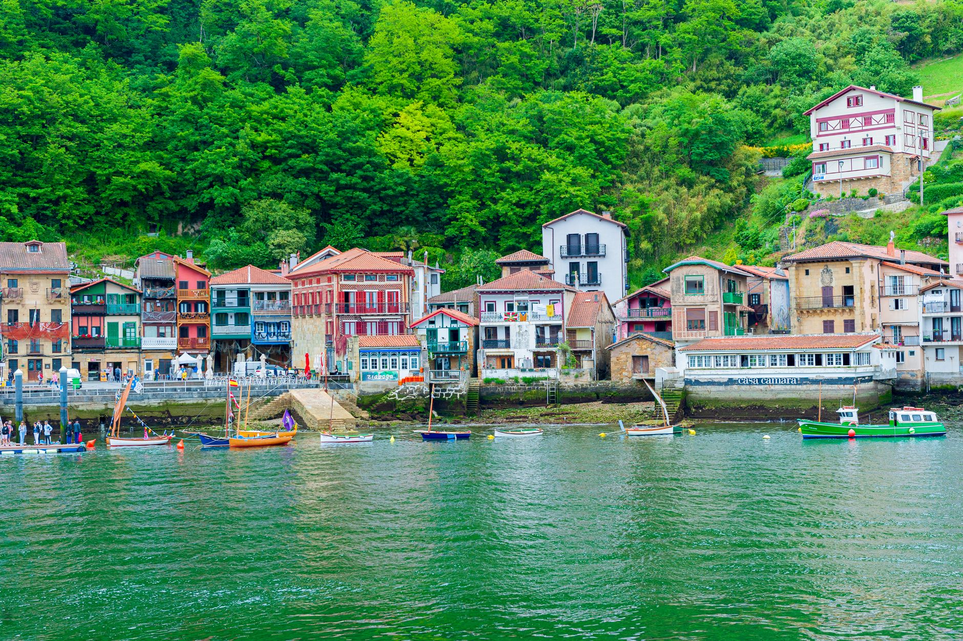 religious procession boat decorated flowers sea coastal village traditional spanish maritime celebration