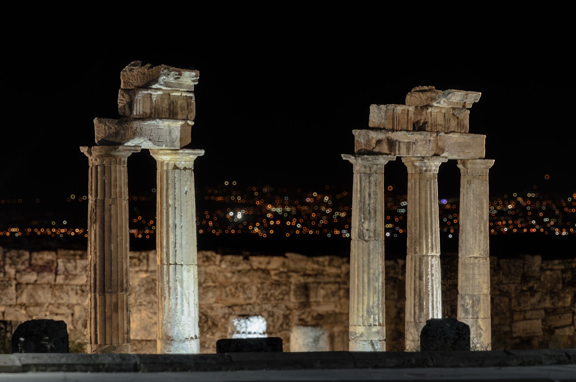 nocturnal tour roman archaeological site, visitors with torches, ancient mosaics glowing mysterious shadows