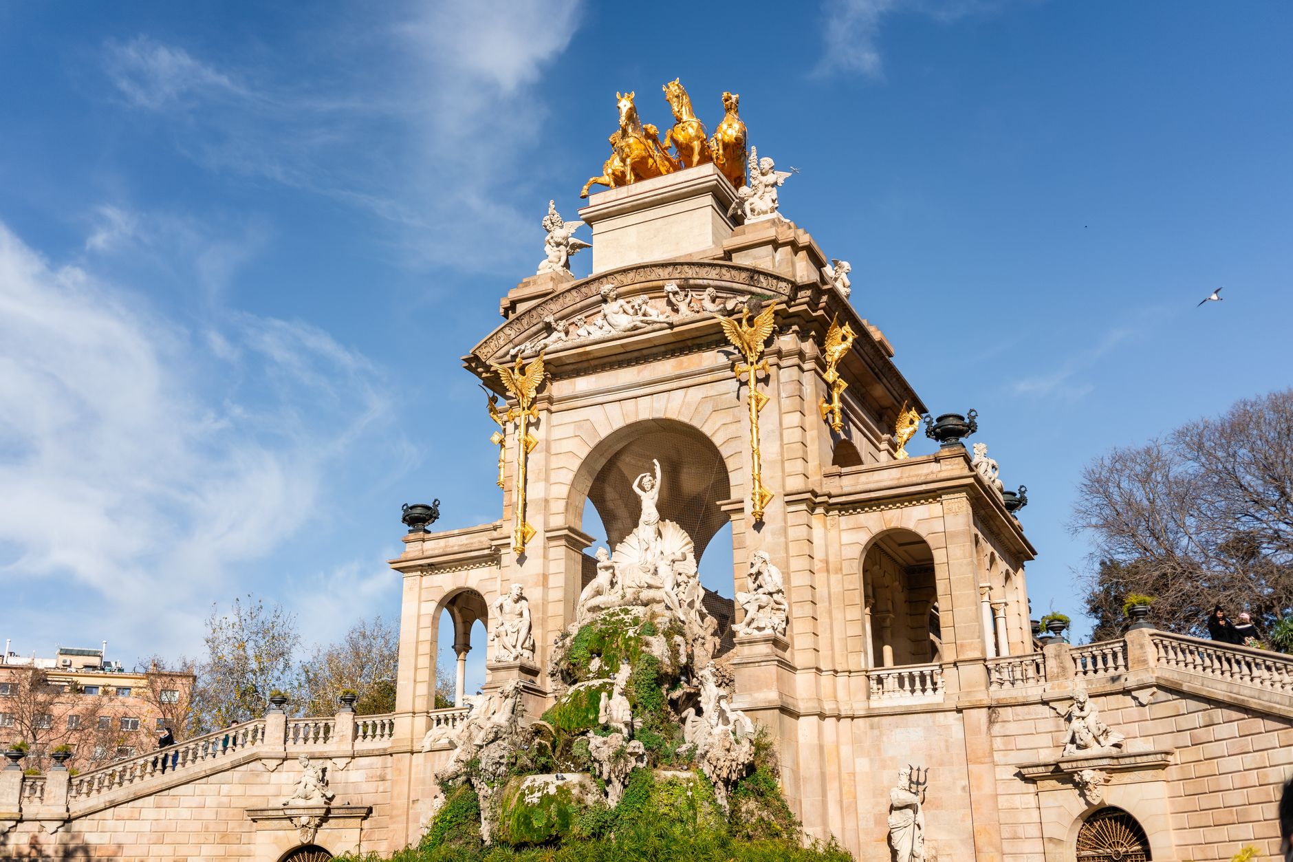 ornate baroque fountain scaffolding restoration golden hour Madrid landmark