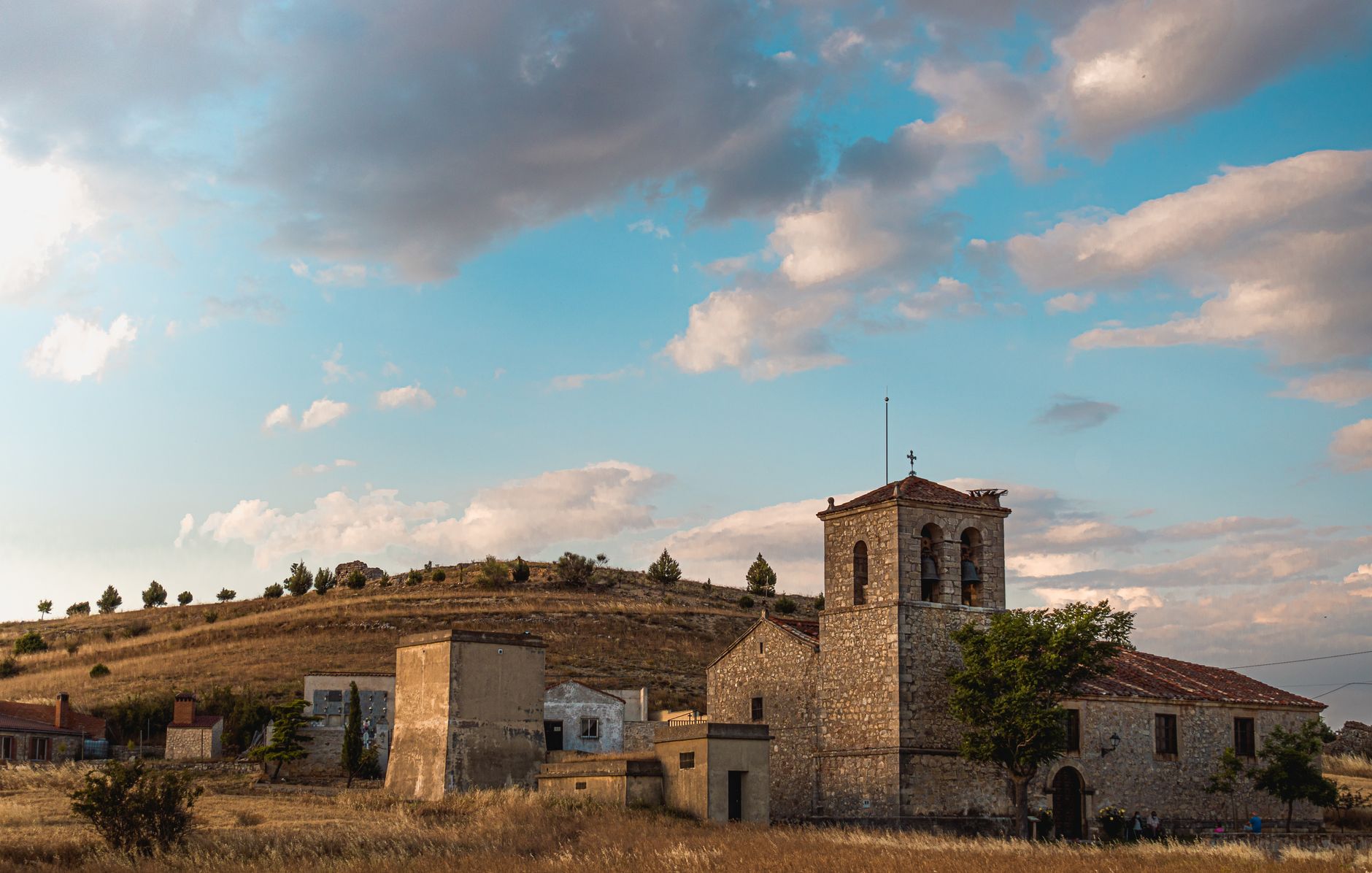 empty stone village church interior golden afternoon light rural Spain