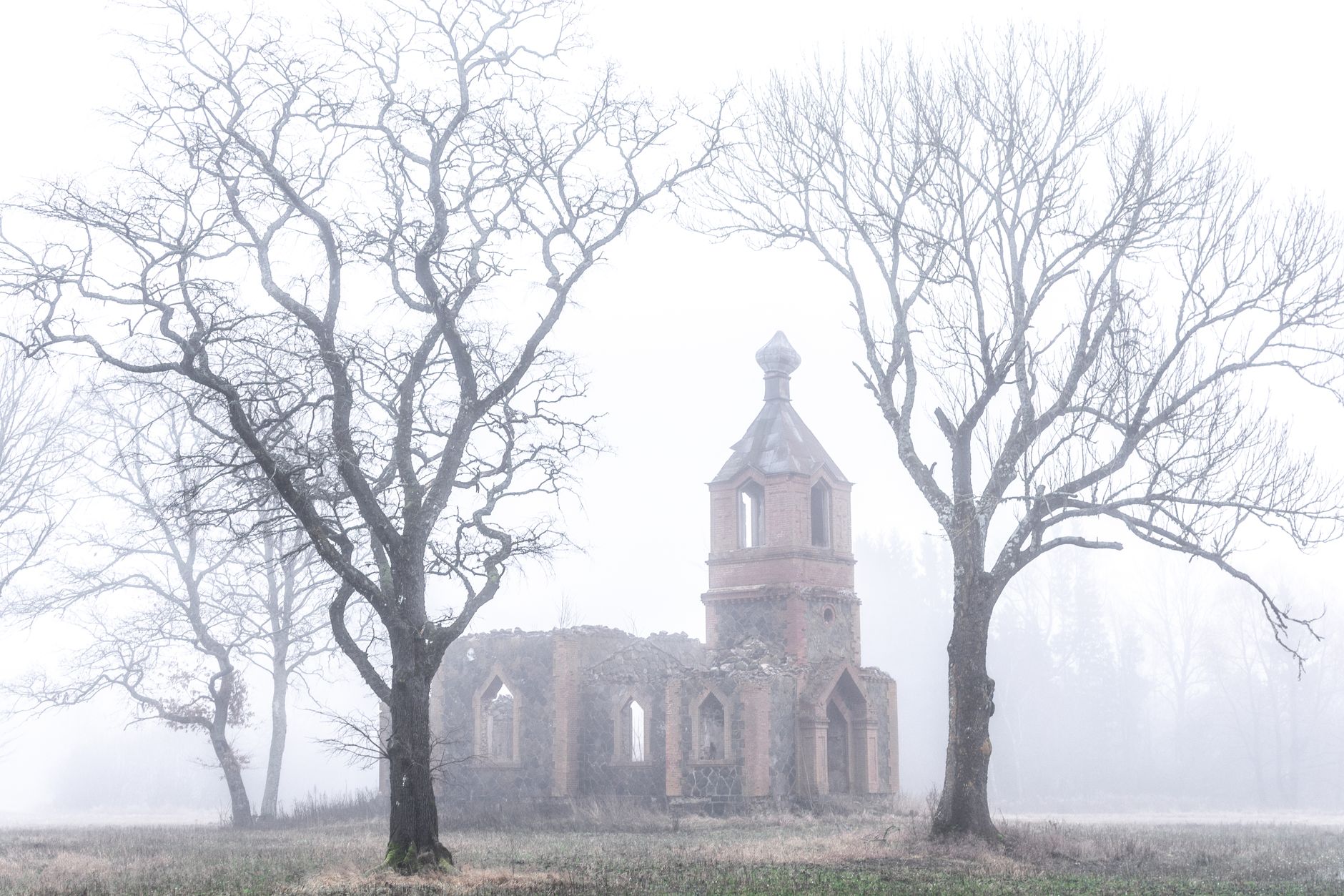 abandoned 19th century spanish village ruins misty foggy cemetery stone buildings decay atmospheric gothic